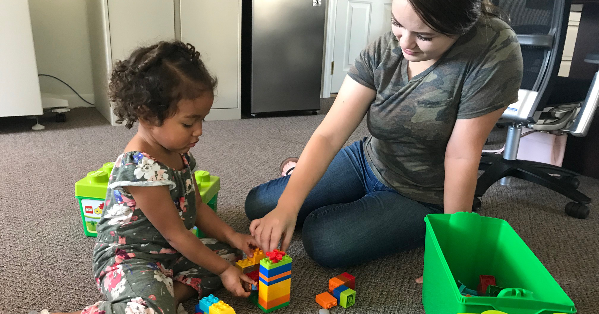 Daughter and mother playing with blocks