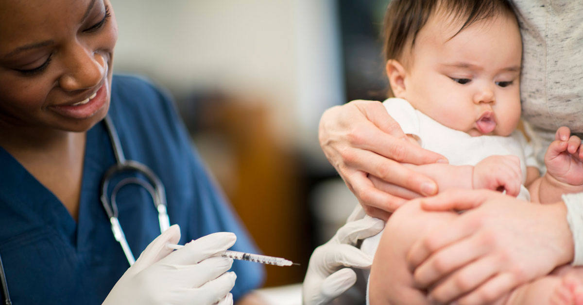 Nurse giving a baby a vaccination